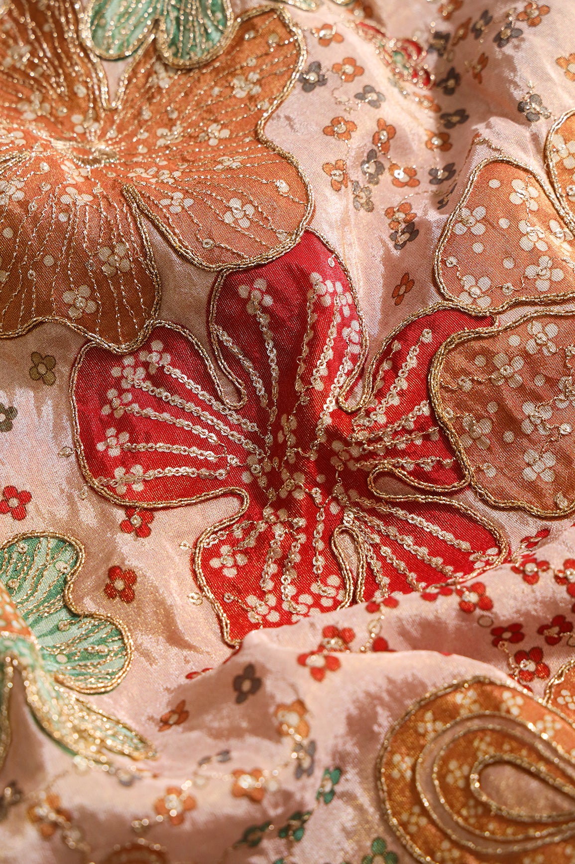 Floral Position Print On Sequins With Zari Embroidery On Light Peach Viscose Zari Tissue Fabric
