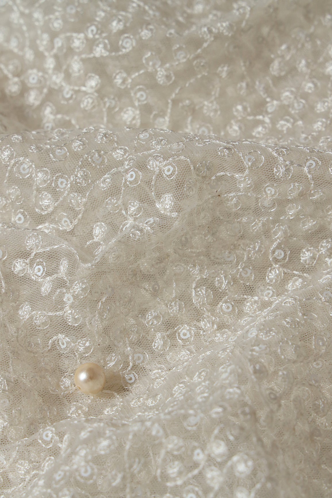 White Thread With White Small Sequins Abstract Embroidery Work On Dyeable White Soft Net Fabric
