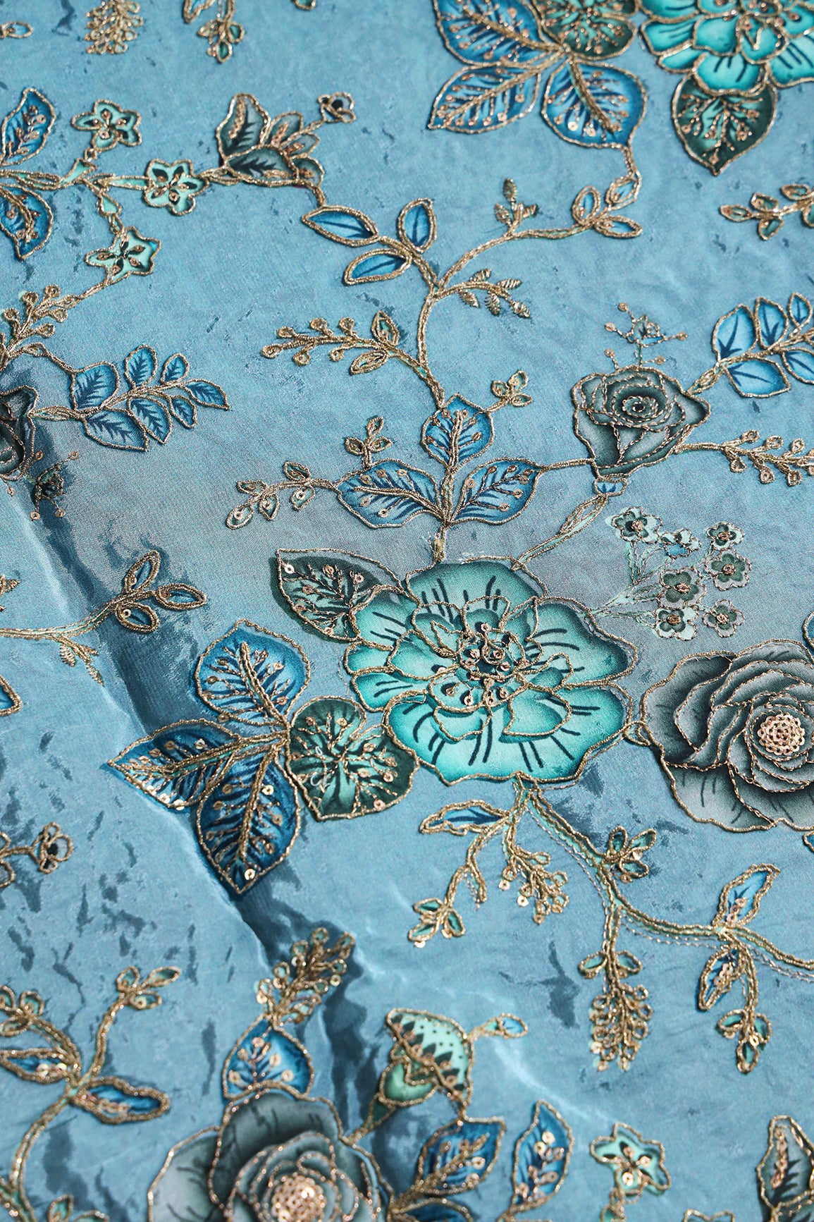 Floral Position Print On Sequins With Zari Embroidery On Light Blue Shiny Viscose Zari Tissue Fabric