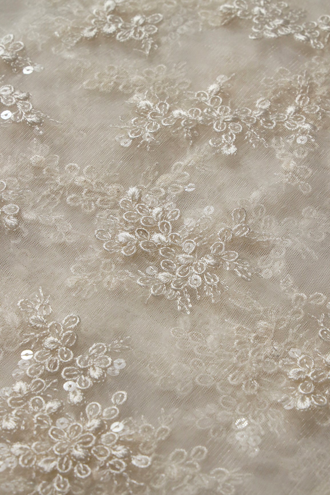 Exclusive White Thread With Sequins Abstract Embroidery Work On Dyeable White Soft Net Fabric