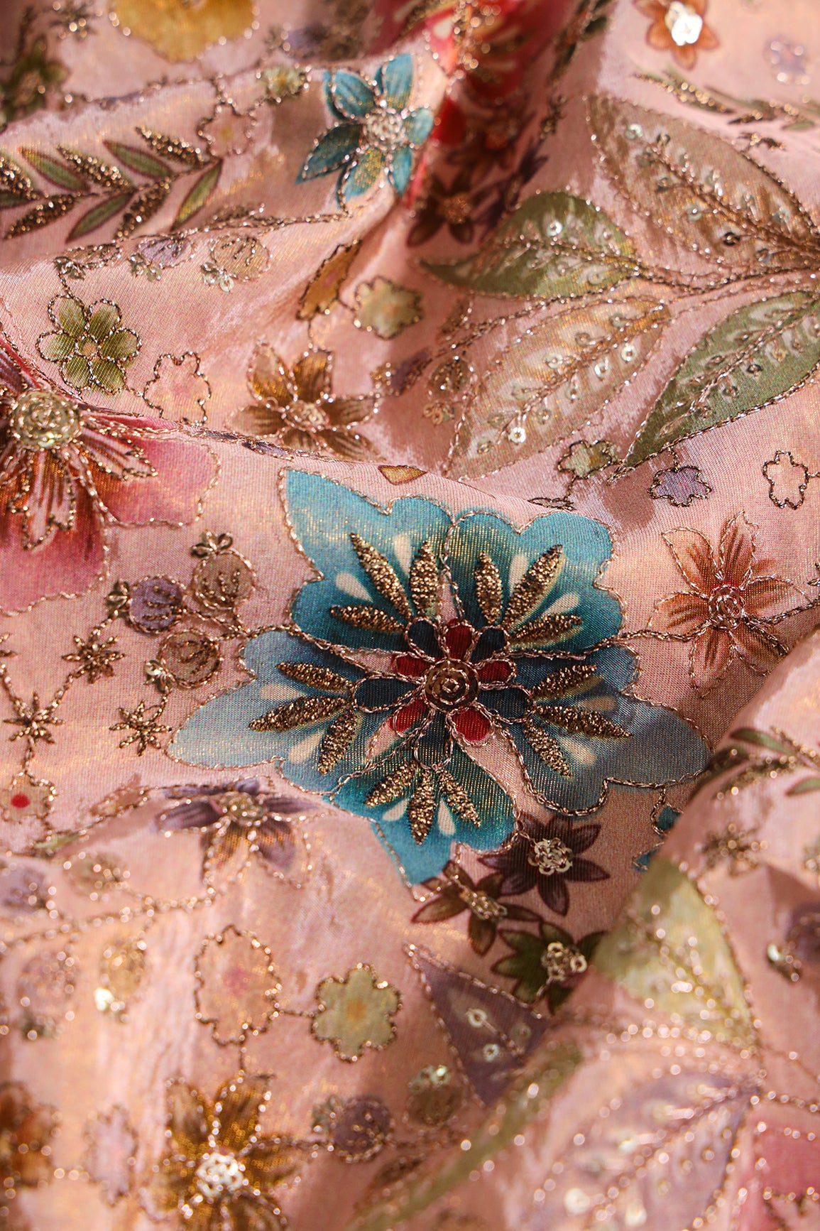 Floral Position Print On Sequins With Zari Embroidery On Peach Viscose Zari Tissue Fabric
