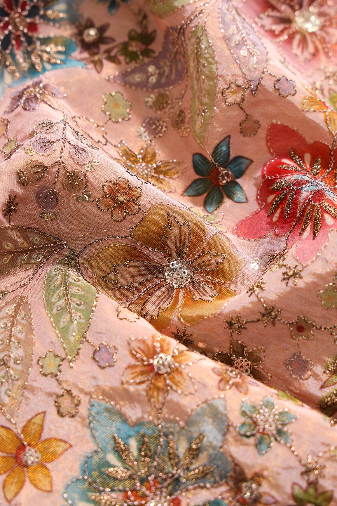 Floral Position Print On Sequins With Zari Embroidery On Peach Viscose Zari Tissue Fabric