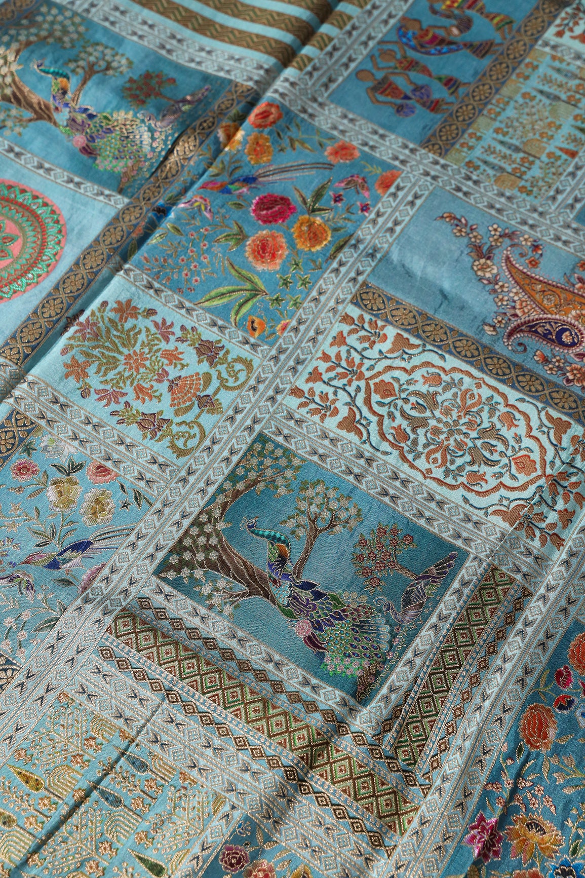 Positional Floral Print On Pastel Blue Viscose Dola Silk Jacquard Fabric