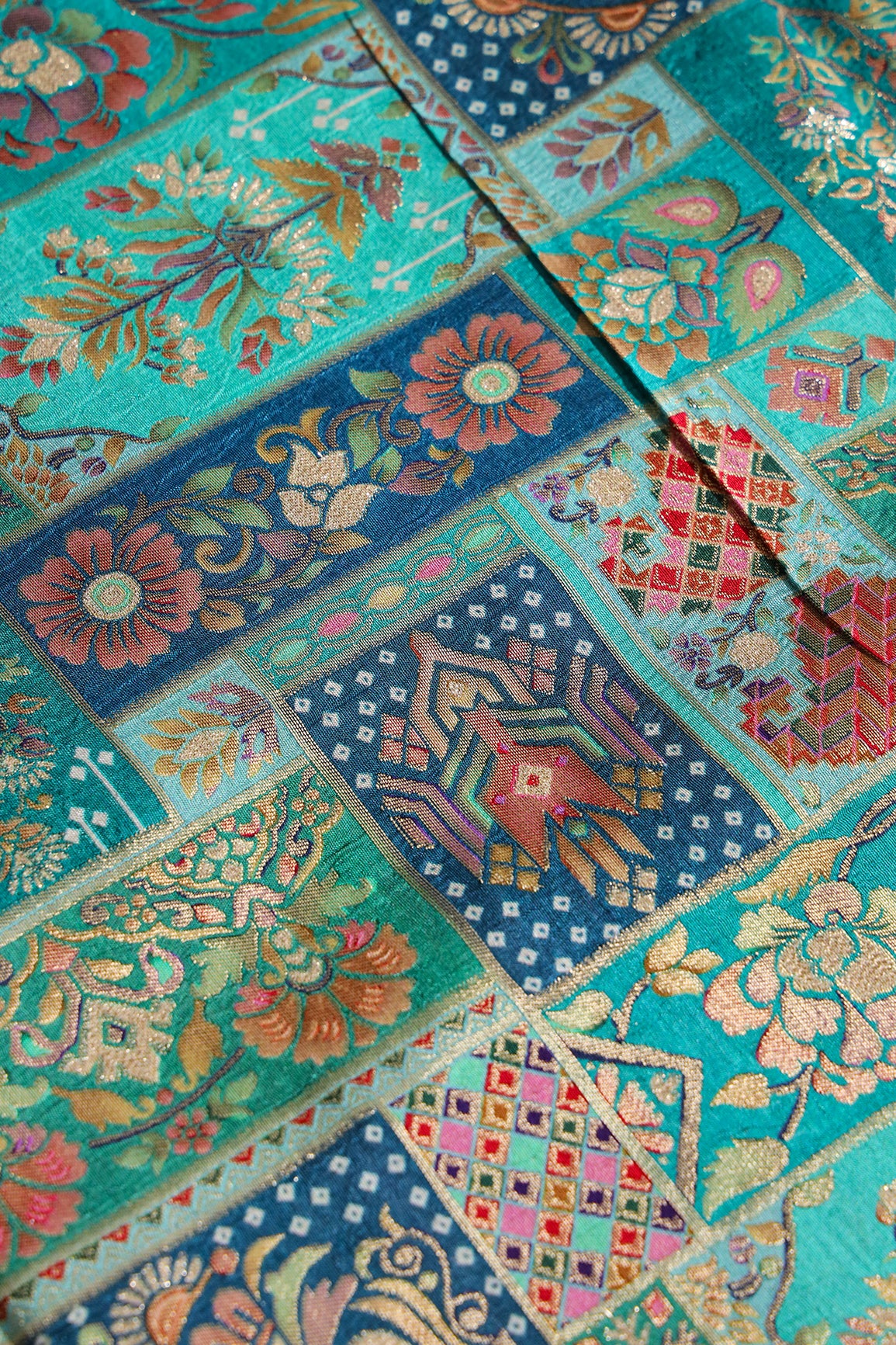 Positional Floral Print On Teal Viscose Dola Silk Jacquard Fabric
