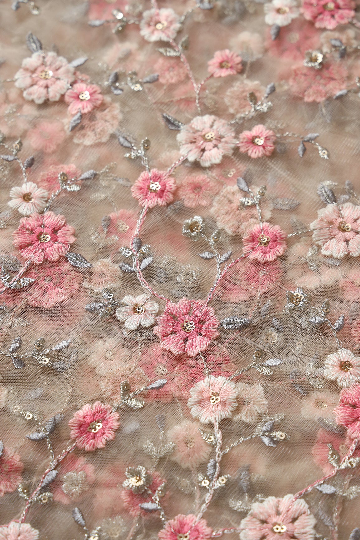 Pink And Cream Thread With Gold Sequins Floral Embroidery On Beige Soft Net Fabric