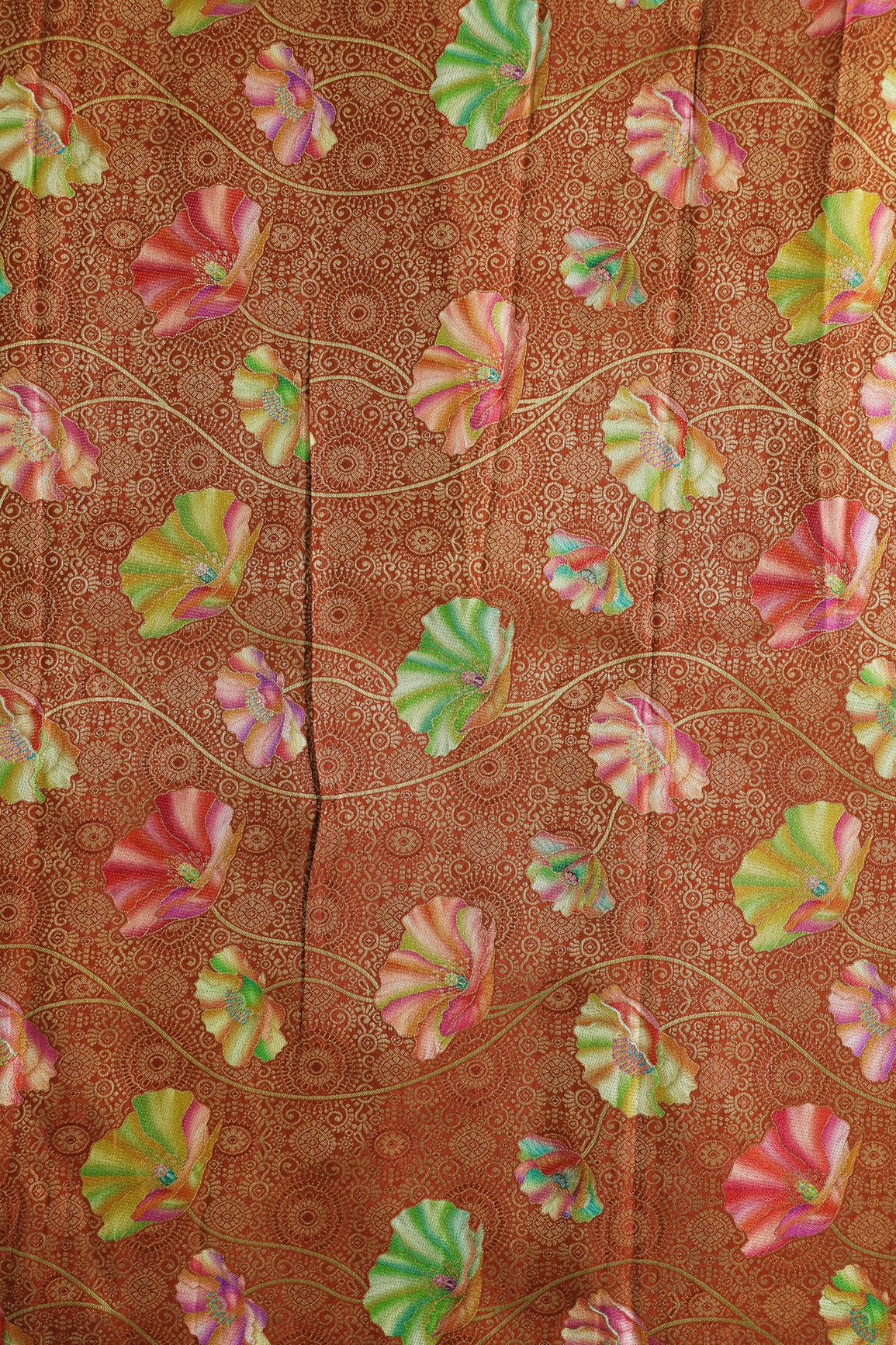 Positional Print On Rust Viscose Dola Silk Jacquard Fabric