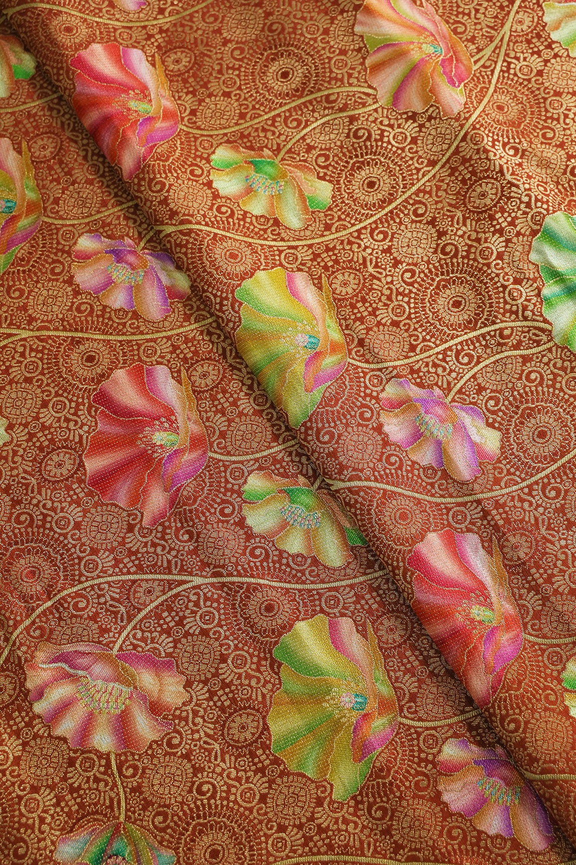 Positional Print On Rust Viscose Dola Silk Jacquard Fabric