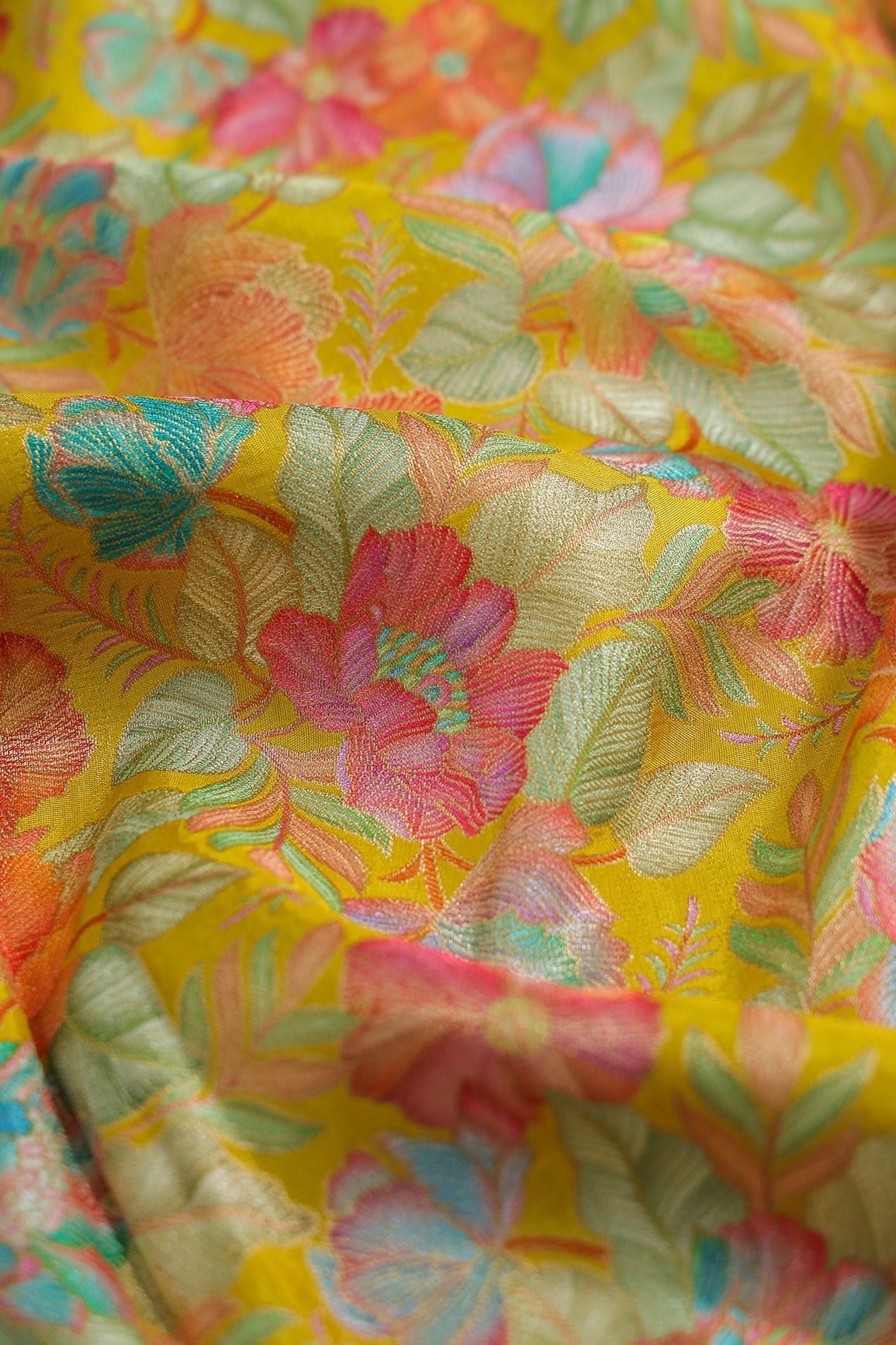 Positional Floral Print On Yellow Viscose Dola Silk Jacquard Fabric