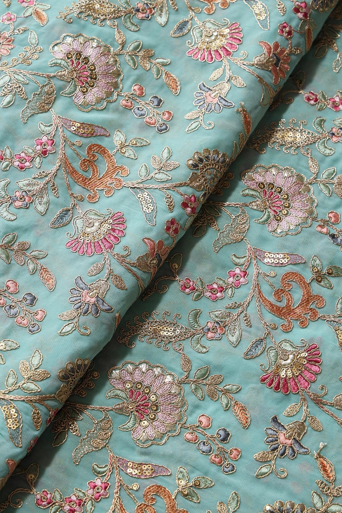 Gorgeous Pastel Threads With Gold Zari Floral Heavy Embroidery On Sky Blue Georgette Fabric