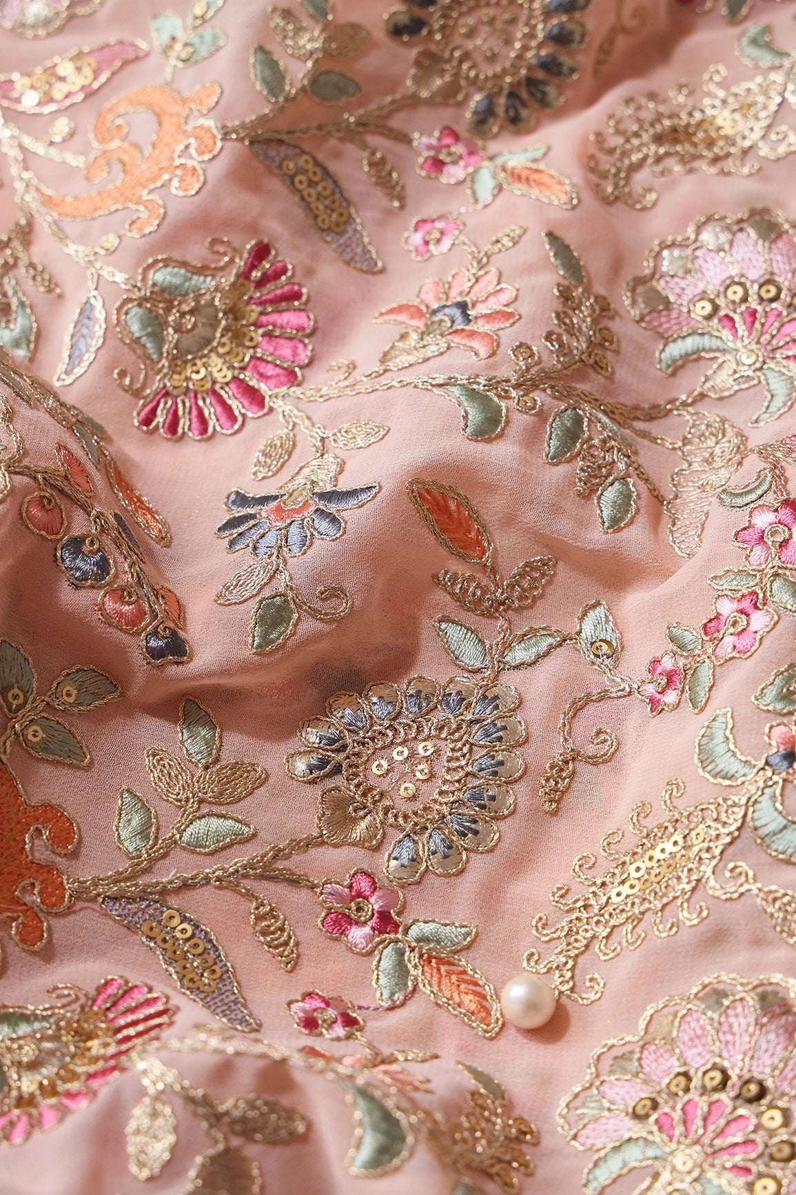 Gorgeous Pastel Threads With Gold Zari Floral Heavy Embroidery On Peach Georgette Fabric