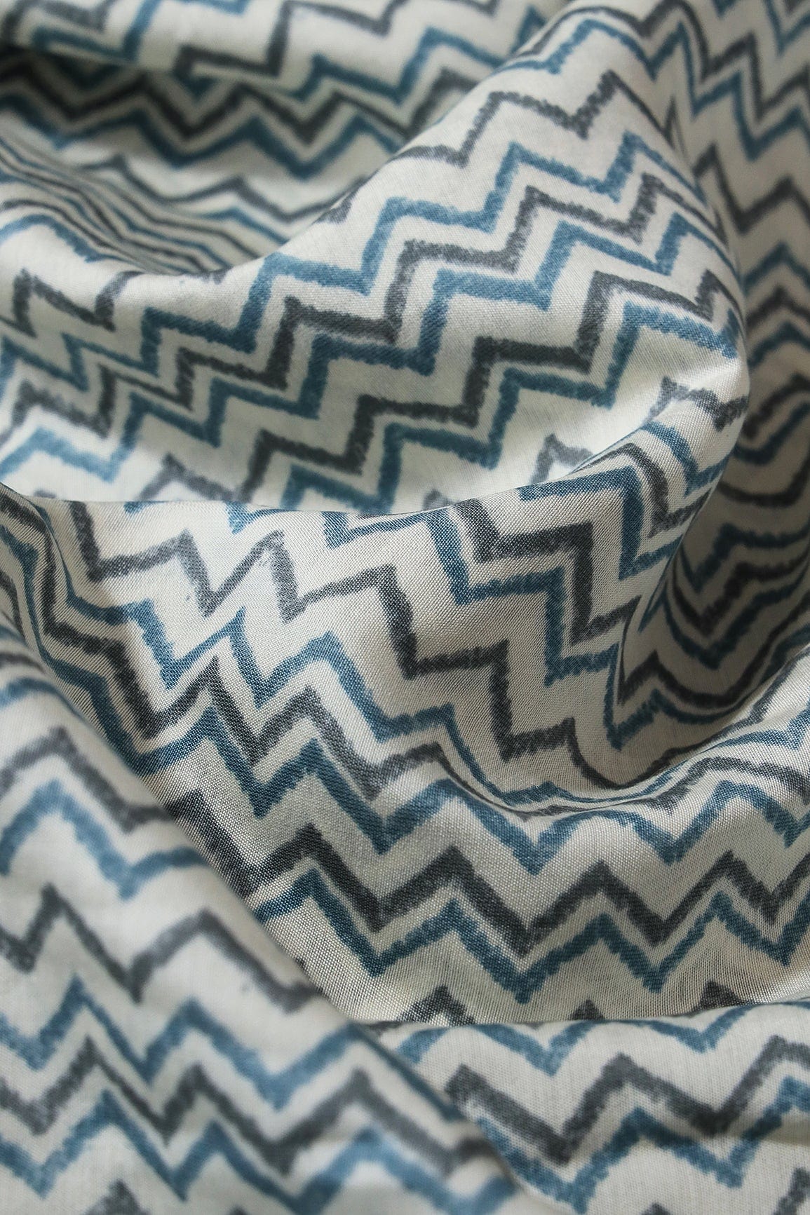 Azzure Blue And Grey Chevron Print On Cream Viscose Chanderi Silk Fabric - doeraa