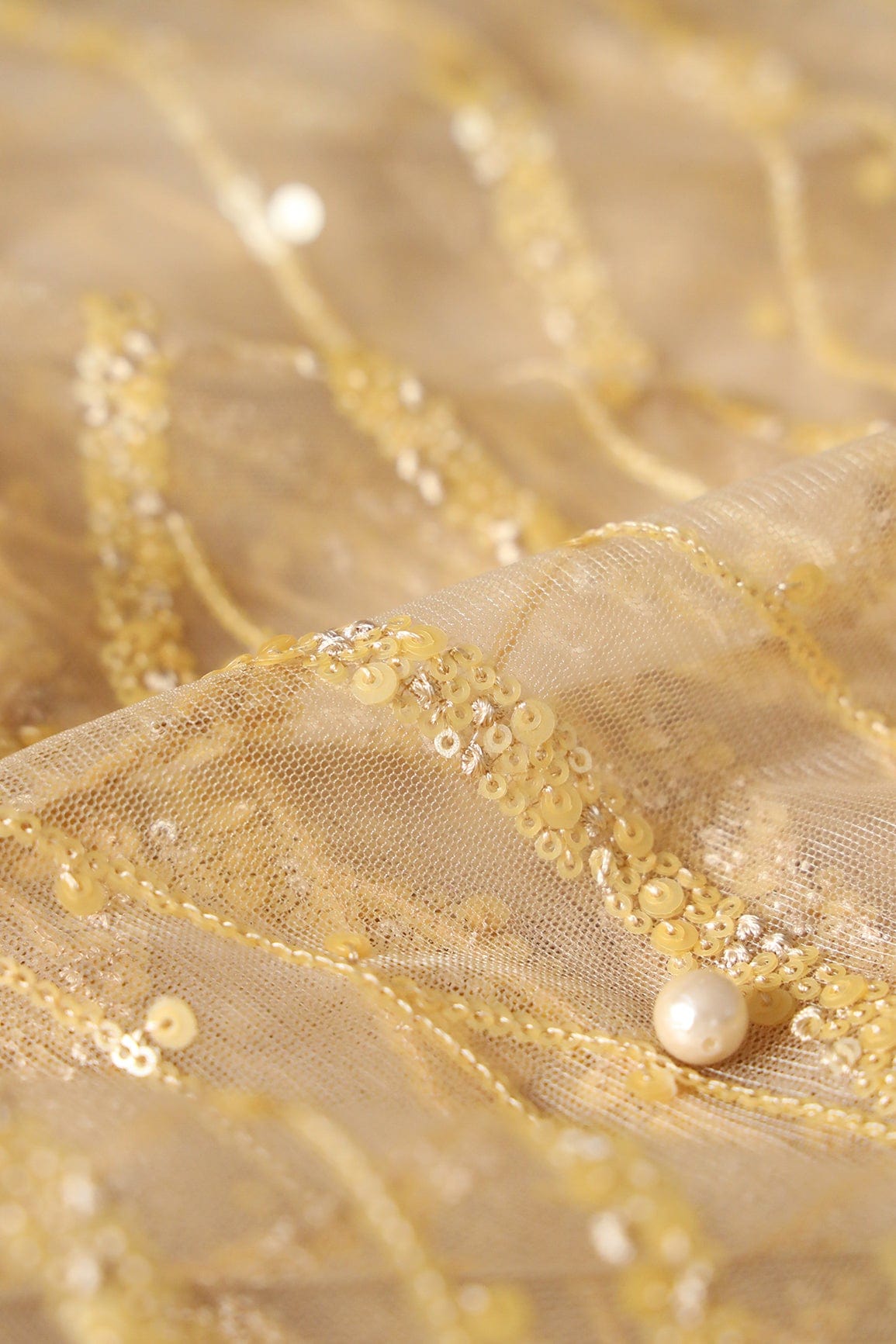 Beautiful Sequins With Beige Thread Wavy Embroidery Work On Beige Soft Net Fabric - doeraa