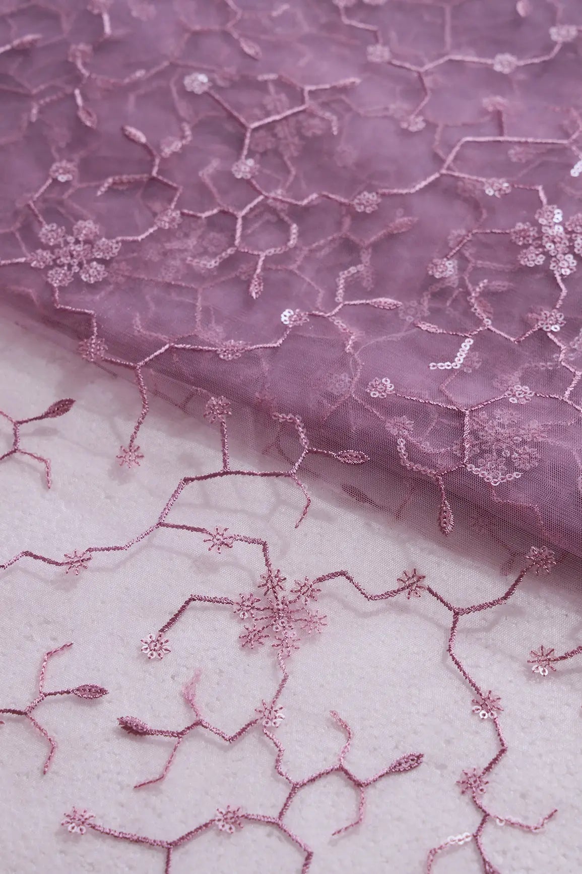 Beautiful Water Sequins Small Floral Embroidery On Mauve Soft Net Fabric - doeraa