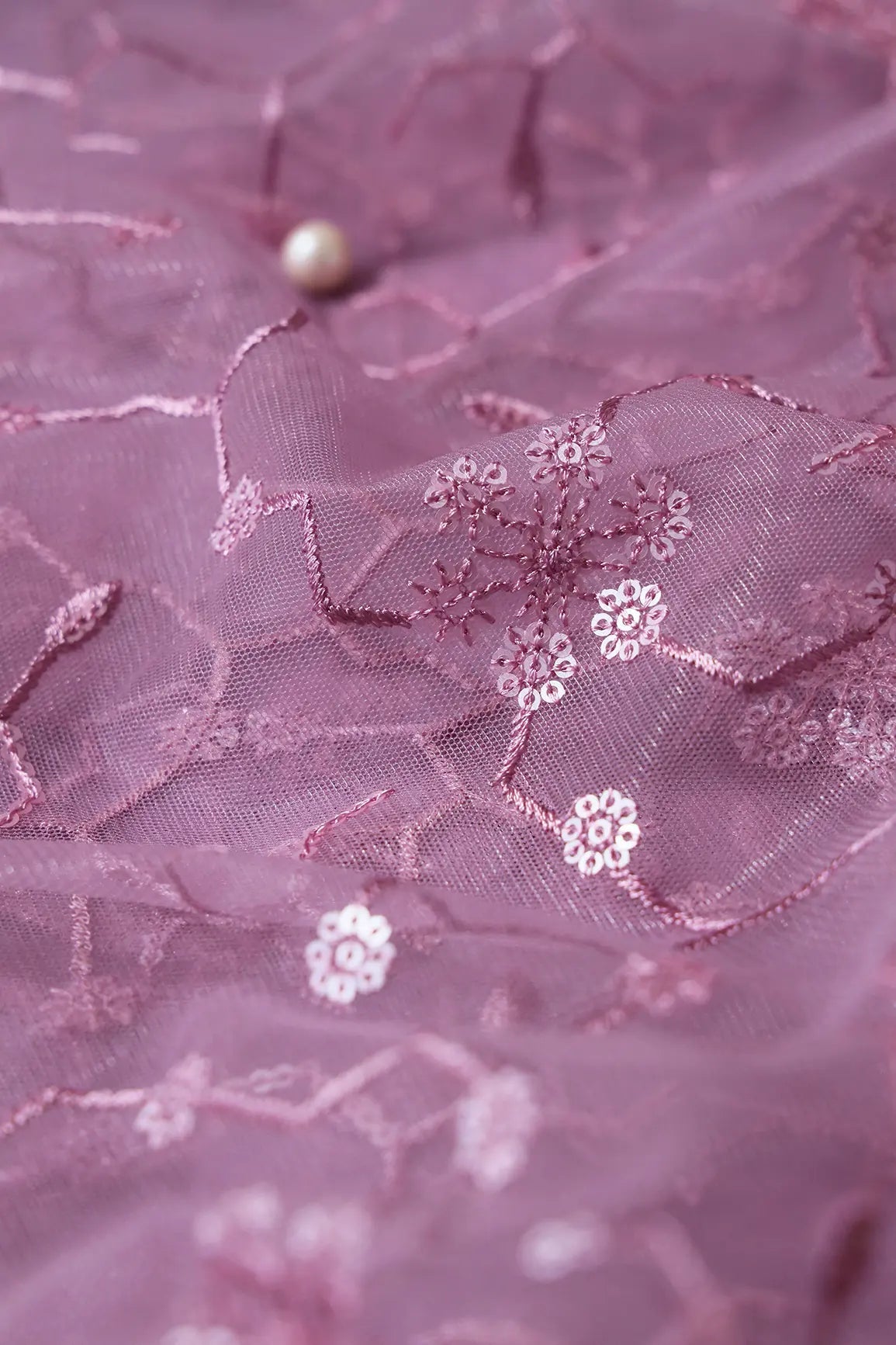 Beautiful Water Sequins Small Floral Embroidery On Mauve Soft Net Fabric - doeraa