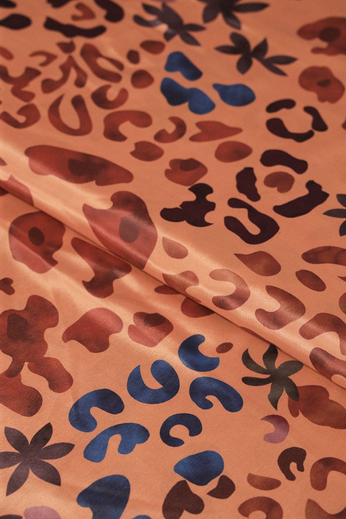 Brown And Blue Abstract Print On Pastel Orange Crepe Fabric - doeraa