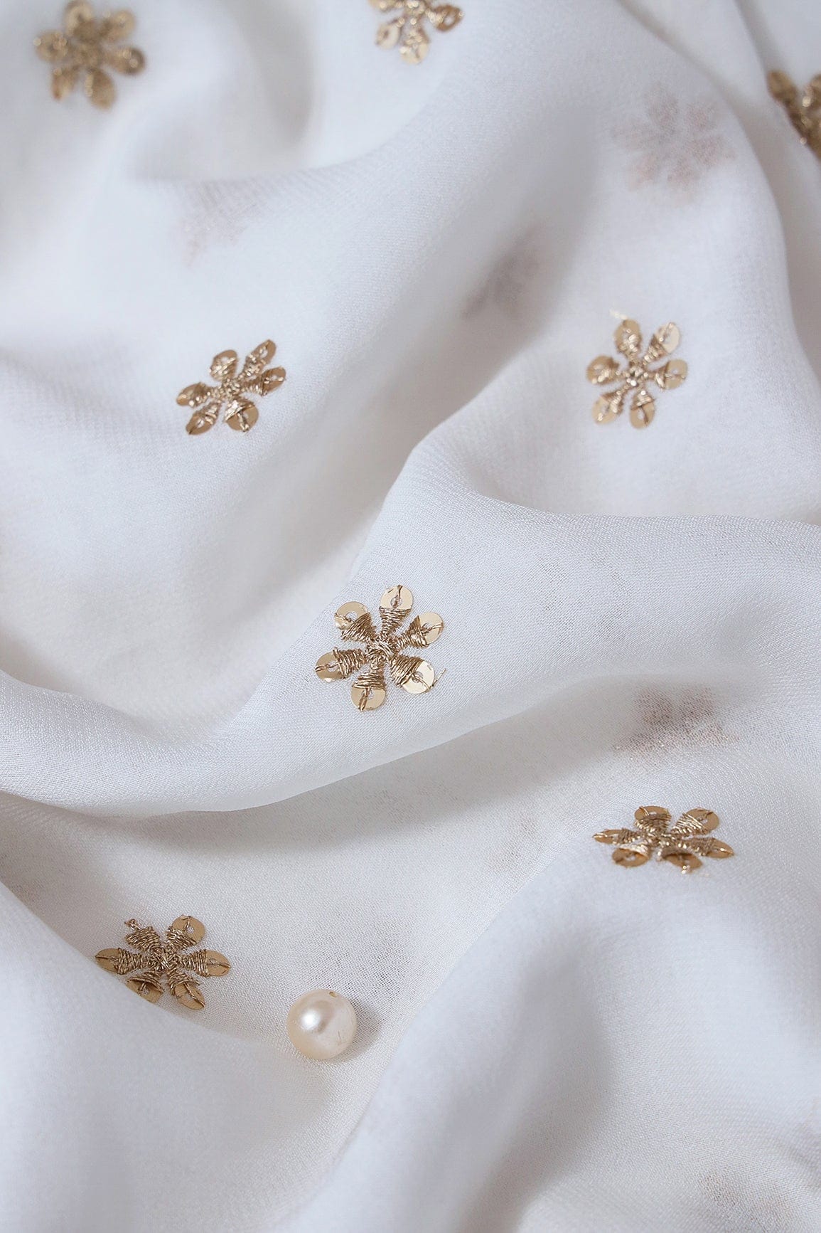 doeraa Embroidery Fabrics Gold Sequins With Gold Zari Beautiful Small Motif Embroidery On White Dyeable Viscose Georgette Fabric