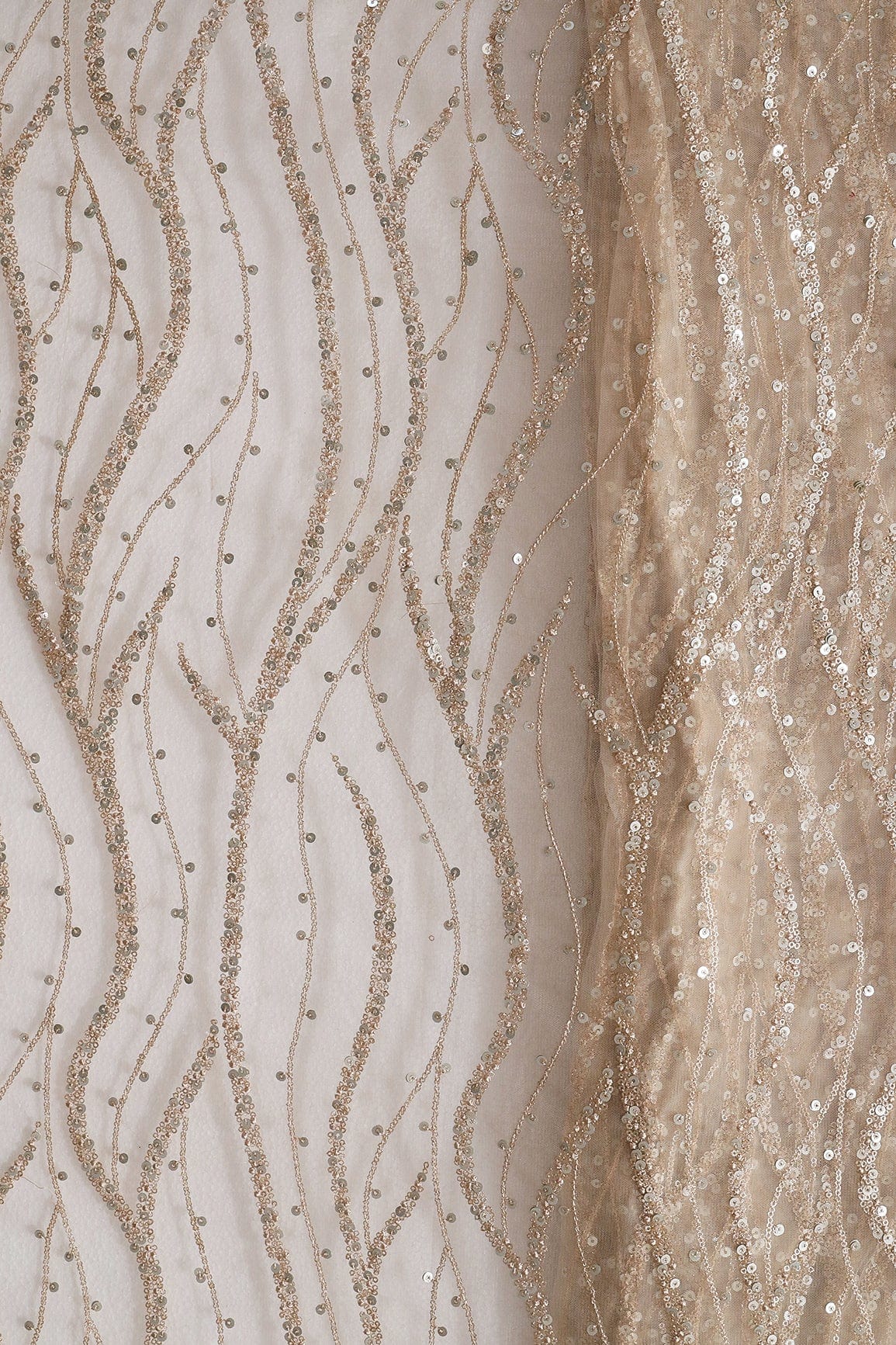 Gold And Silver Sequins With Beige Thread Wavy Embroidery On Light Beige Soft Net - doeraa