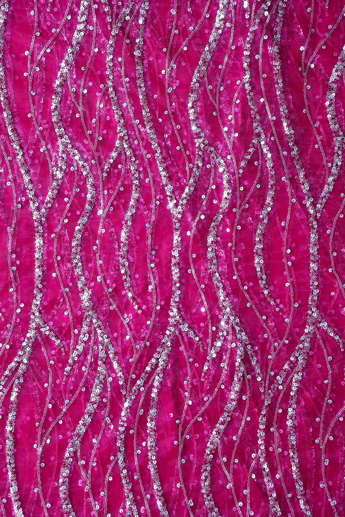 Gold And Silver Sequins With Fuchsia Thread Wavy Embroidery Work On Fuchsia Soft Net Fabric - doeraa