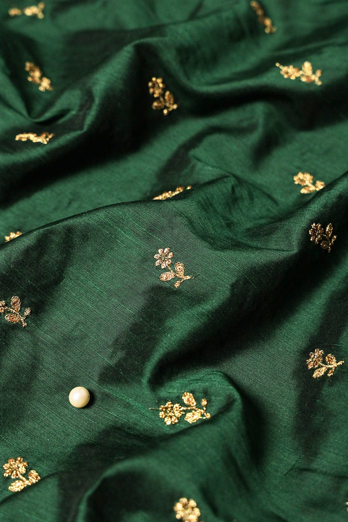 Gold Sequins With Gold Zari Small Floral Motif Embroidery Work On Bottle Green Raw Silk Fabric - doeraa