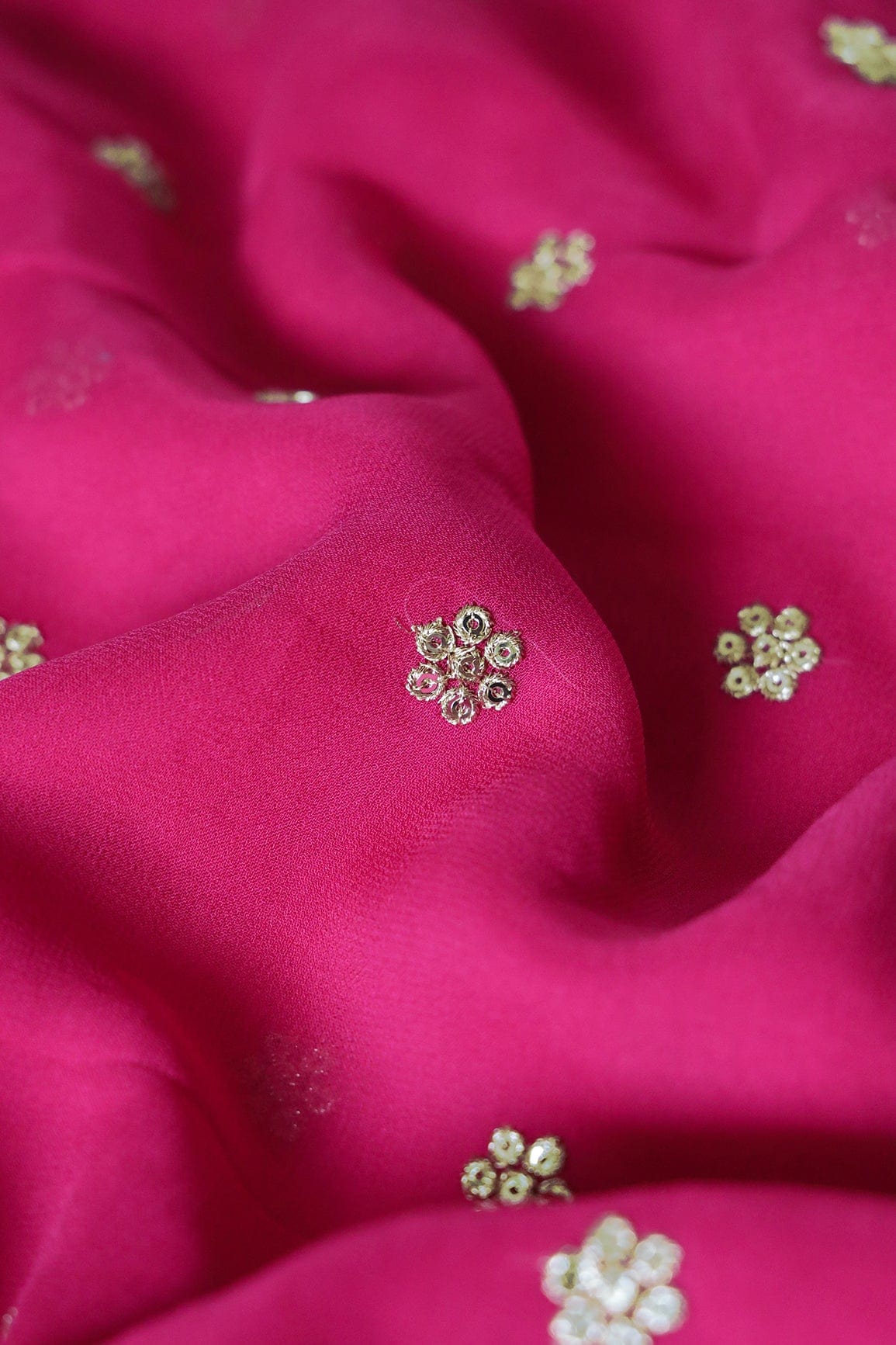 Gold Sequins With Gold Zari Small Motif Embroidery Work On Fuchsia Georgette Fabric - doeraa