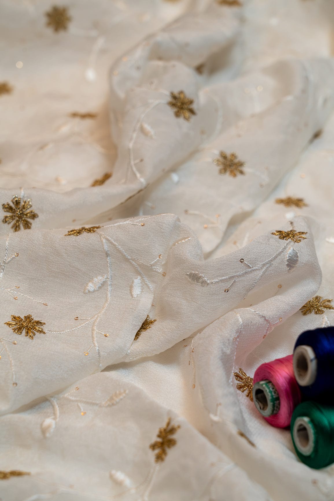 Gold Sequins With White And Gold Thread Floral Embroidery On Dyeable Natural Crape - doeraa