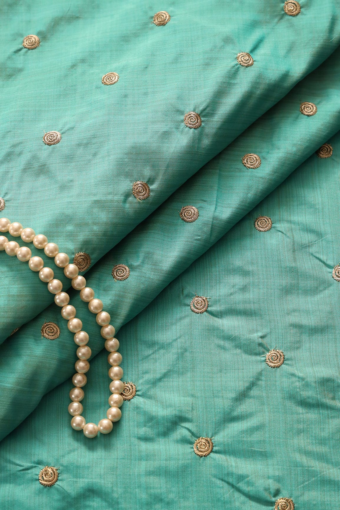 Gold Zari Small Motif Embroidery Work On Rama Bamboo Silk Fabric