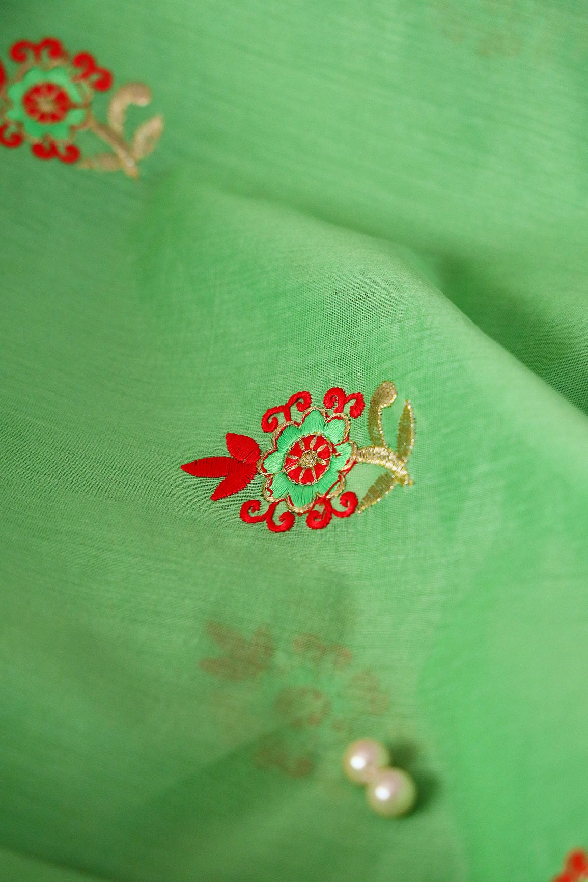 Orange And Green Floral Embroidery On Parrot Green Chanderi Fabric - doeraa