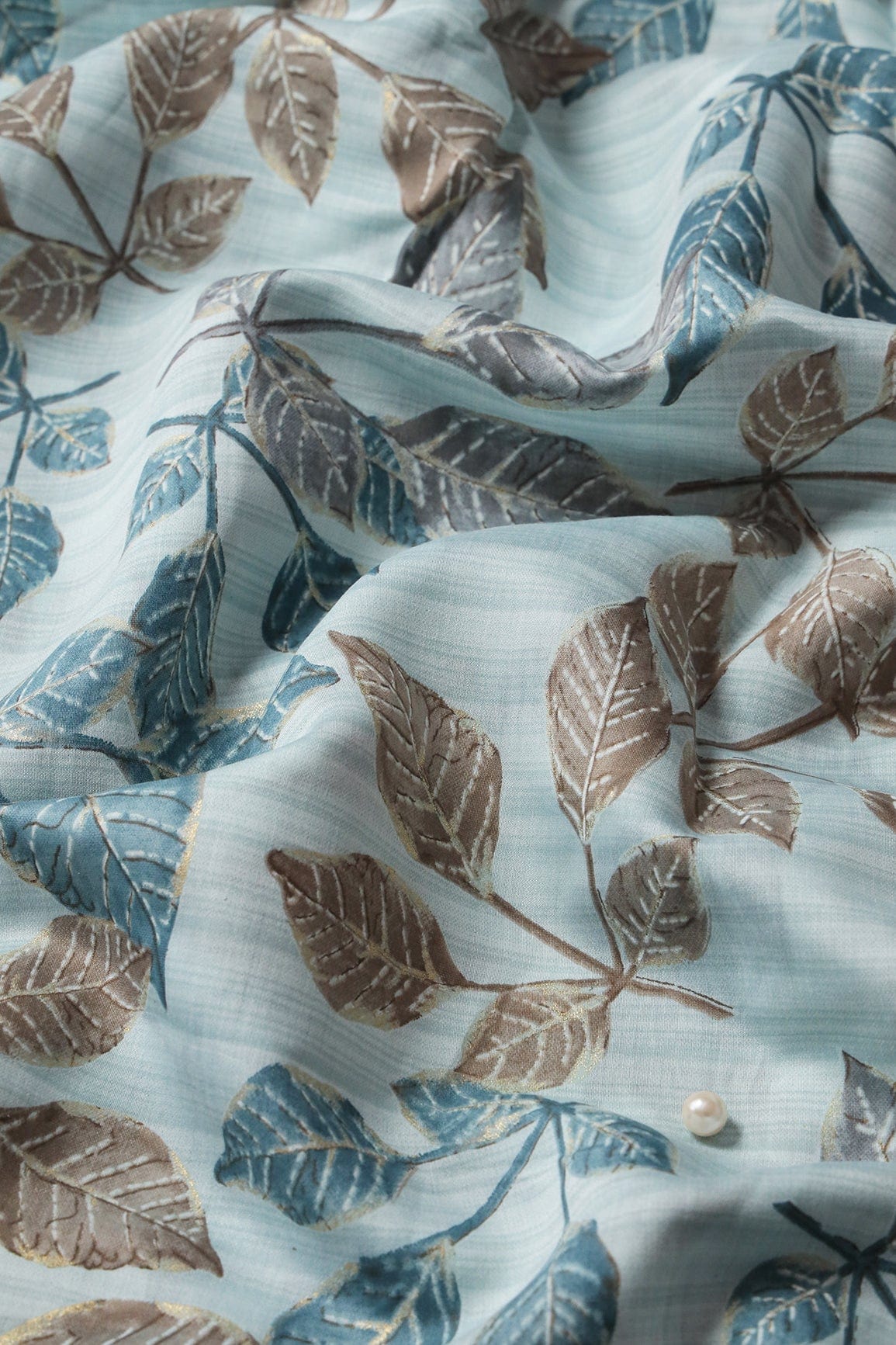 Pastel Blue And Brown Leafy Foil Print On Viscose Chanderi Silk Fabric - doeraa