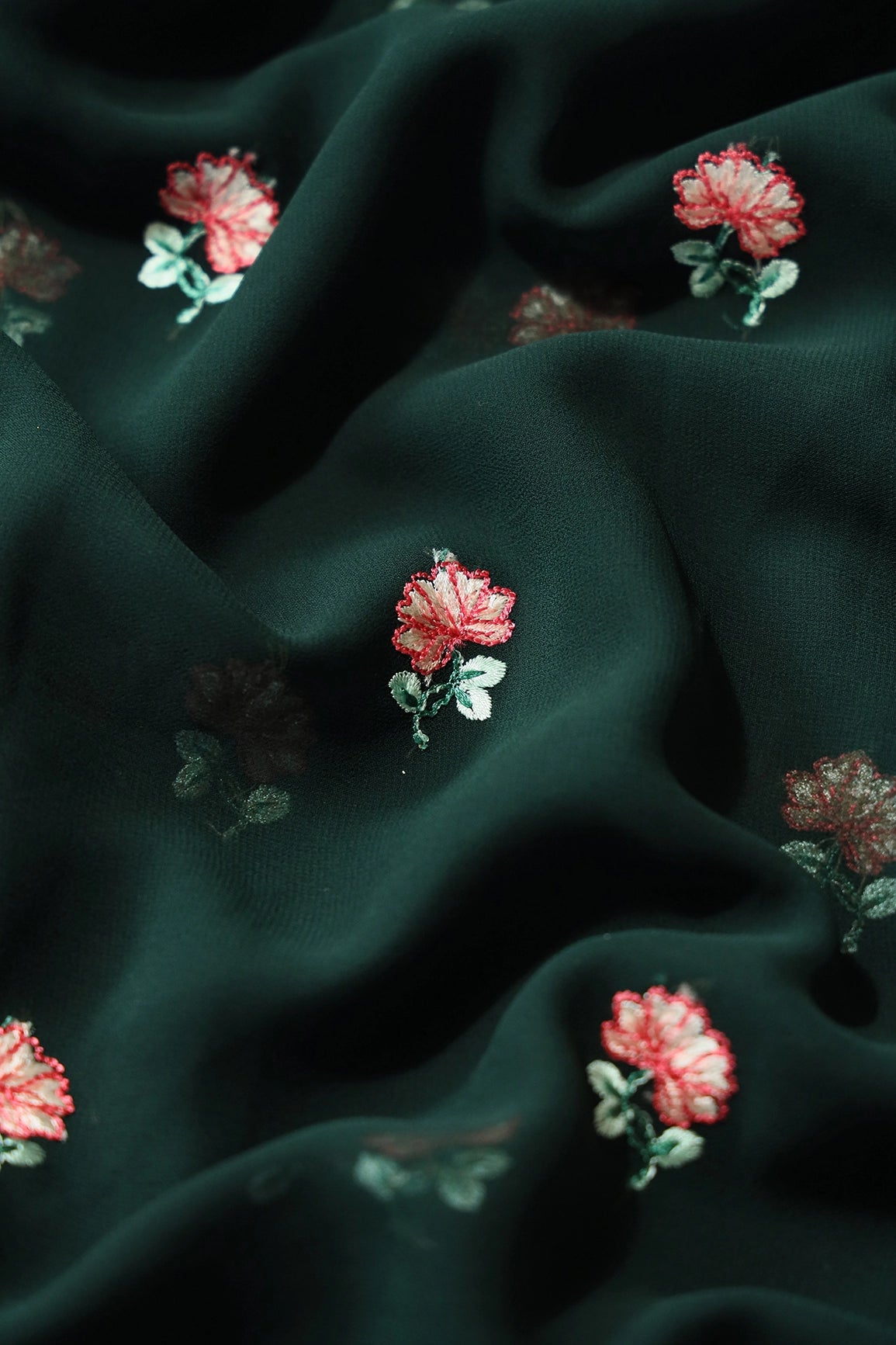 Peach And Green Small Floral Booti Embroidery On Dark Bottle Green Georgette Fabric - doeraa