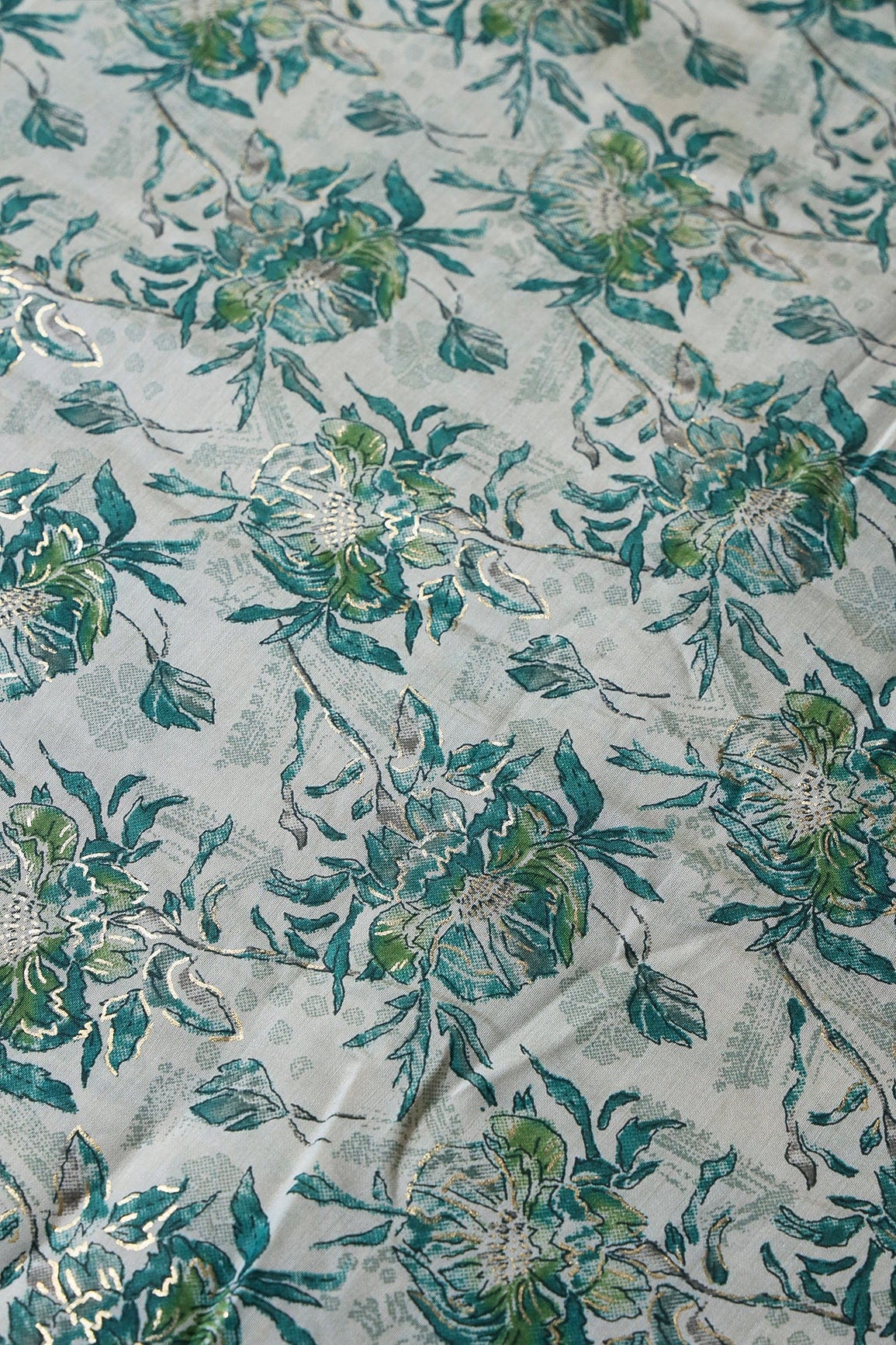 Teal And Cream Floral Foil Print On Viscose Chanderi Silk Fabric - doeraa