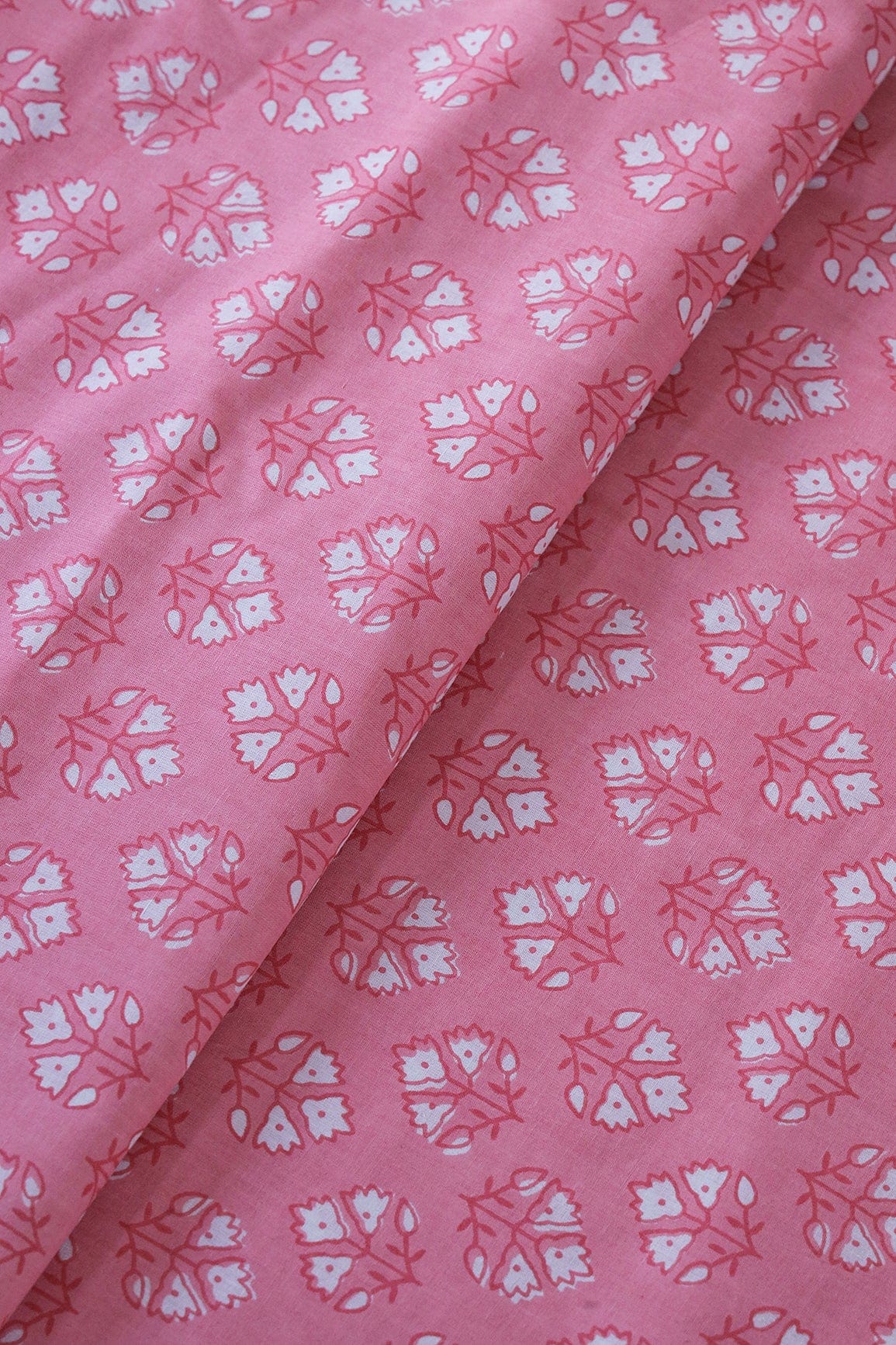 White Floral Booti Pattern Print On Baby Pink Pure Cotton Fabric