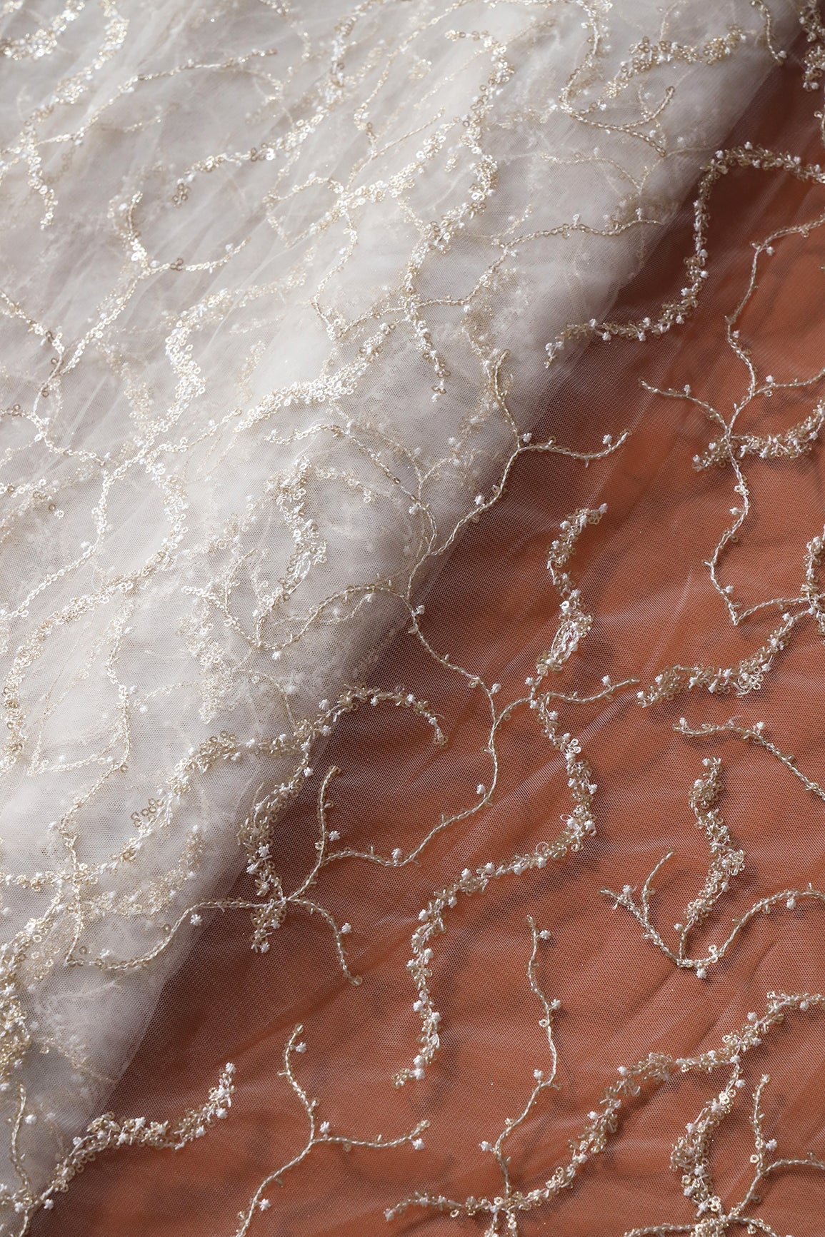 White Thread With Gold Glitter Sequins Abstract Embroidery On White Dyeable Soft Net Fabric - doeraa