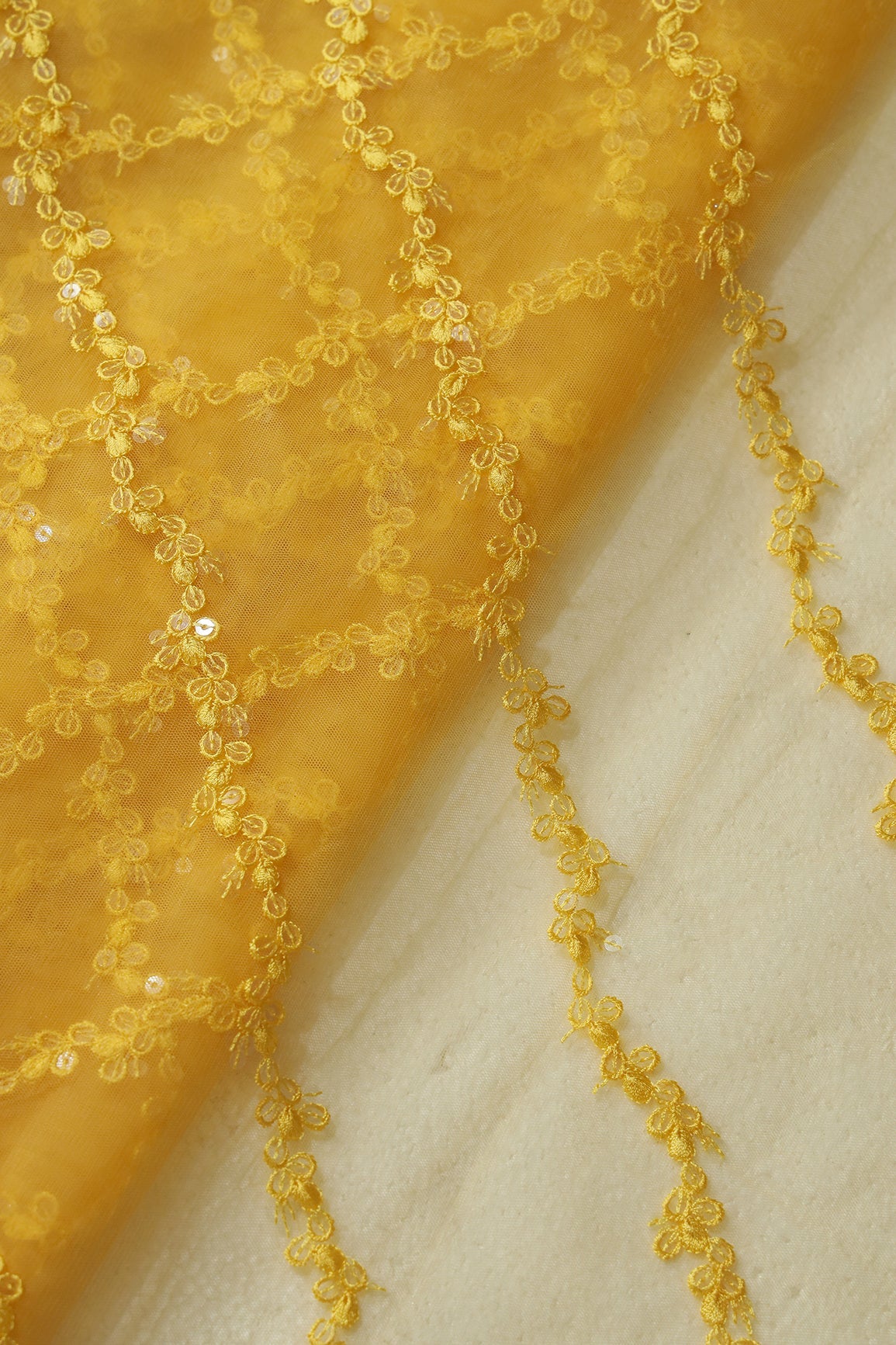 Yellow Thread With Sequins Strip Embroidery Work On Yellow Soft Net Fabric - doeraa