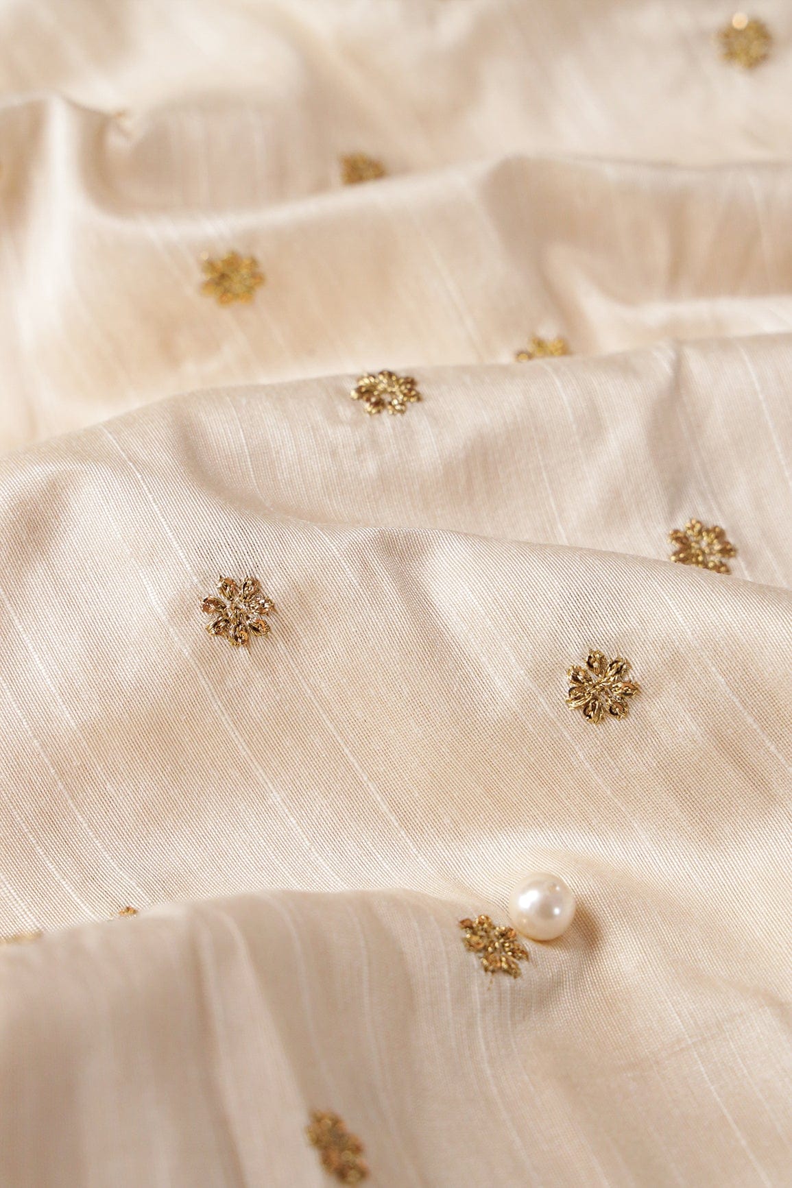 doeraa Embroidery Fabrics Gold Sequins With Gold Zari Small Motif Embroidery Work On White Raw Silk Fabric