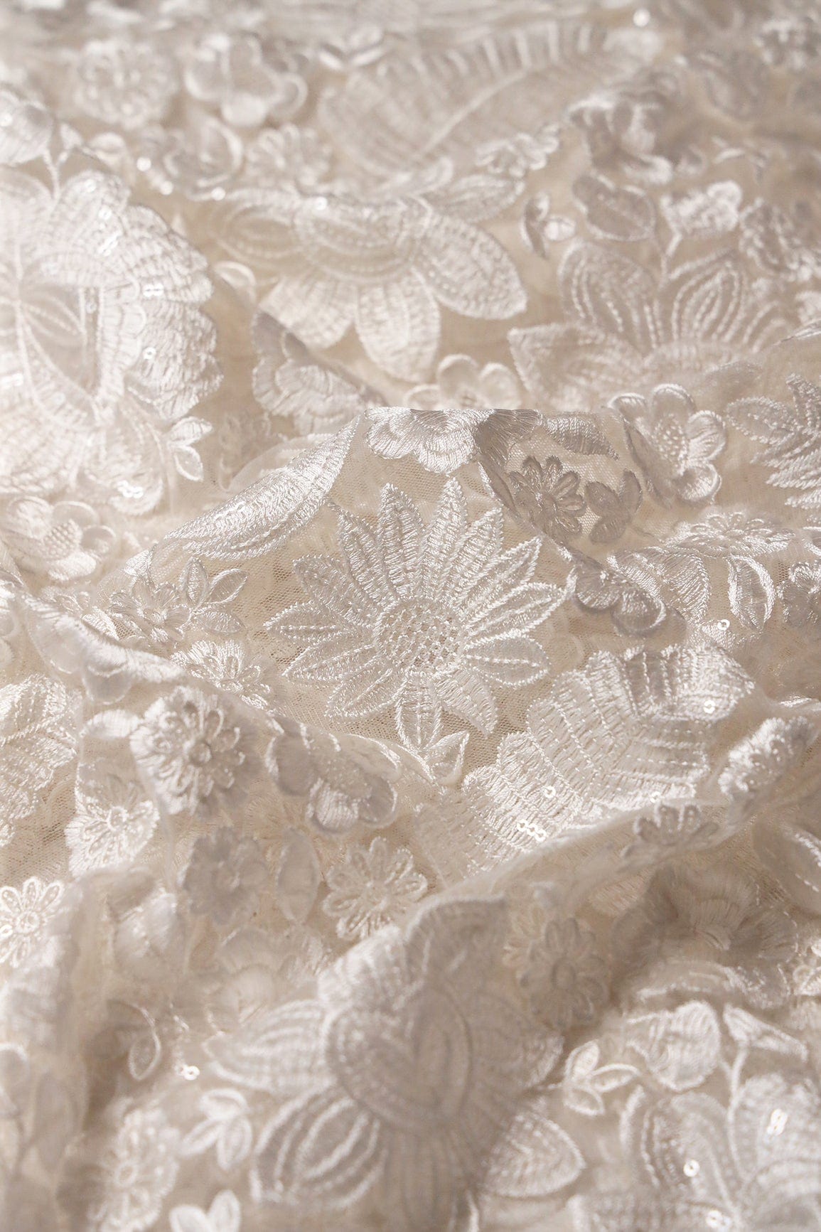 doeraa Embroidery Fabrics White Thread With Sequins Heavy Floral Embroidery On White Dyeable Soft Net Fabric