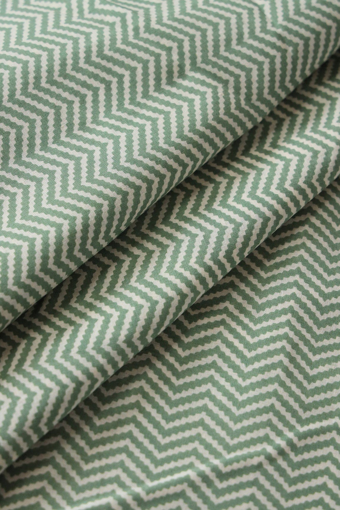 doeraa Prints Olive Green And Cream Chevron Print On Pure Cotton Fabric