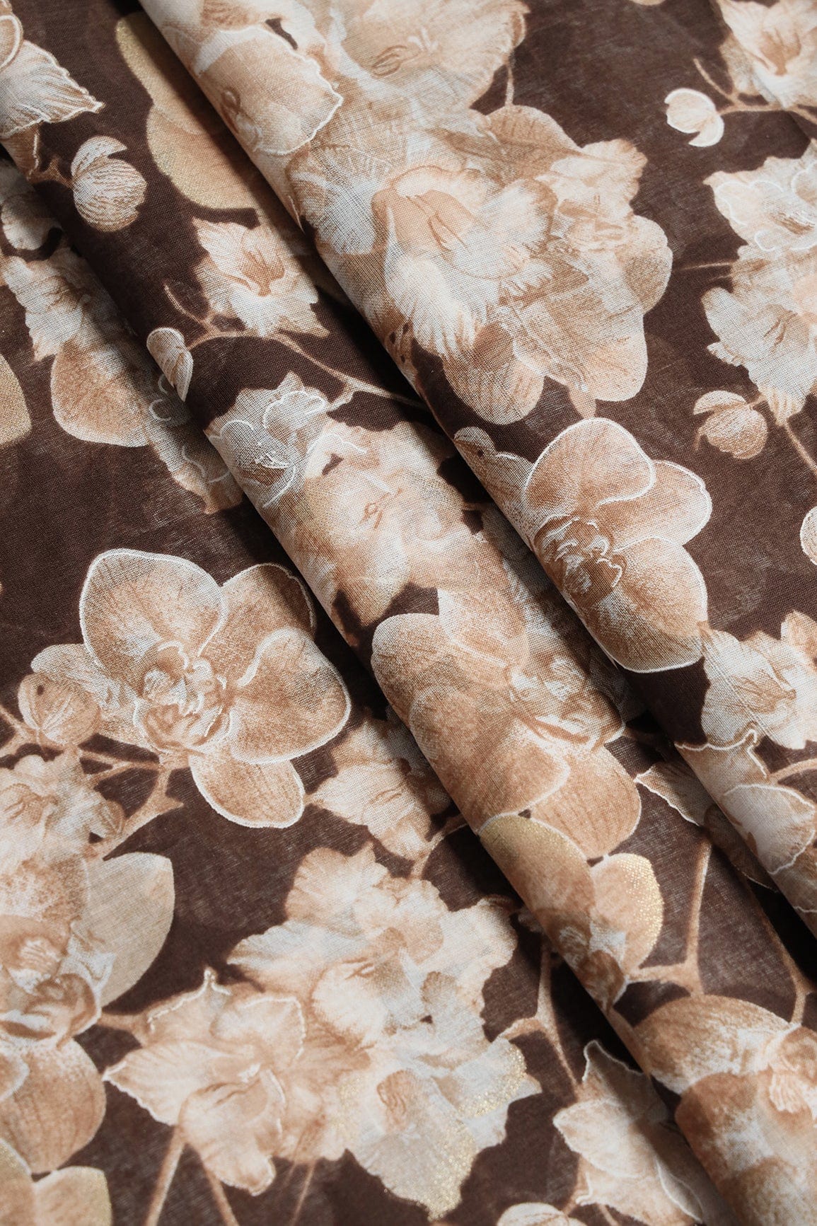 doeraa Prints White And Beige Floral Foil Print On Brown Pure Mul Cotton Fabric